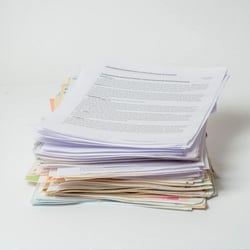 a small pile of legal files